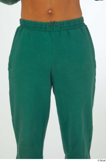 Nathaniel dressed green jogging pants sports thigh 0001.jpg